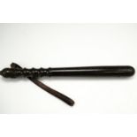 A vintage police turned hardwood truncheon, with leather wrist strap, 39.5 cm