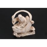 A Japanese Ivory netsuke of a Tennin riding a fish, 5 cm