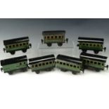 Five Marklin 17190 O gauge passenger carriages in green livery, a 17200 baggage car in green livery,