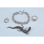 A selection of silver jewellery comprising a haematite set lizard, marked "925", 9 cm long, a link