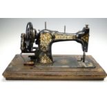 A cased Jones hand sewing machine