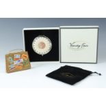 A boxed Vanity Fair powder compact together with a 1960s novelty BOAC gilt powder compact in the