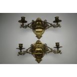 A pair of Art Nouveau influenced brass folding two-branch wall sconces, 24 cm arm