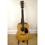 An Encore model number EA255 acoustic guitar with soft case and stand
