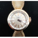 A lady's Universal of Geneva 18ct yellow metal dress watch, having a manual wind movement and