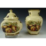 An Aynsley "Orchard Gold" hexagonal vase together with a matching covered pot, tallest 17 cm