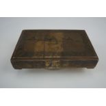 A Middle Eastern niello and white metal (tested as silver) table box, of shallow rectangular form,