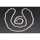 A cultured baroque pearl necklace, as a continuous string, 84 cm, together with a cultured baroque