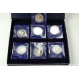 Seven commemorative Crown coins including "QEII Isle of Man 2006" etc