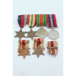 A mounted group of four Second World War British campaign medals together with two Africa Stars