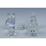 A Swarovski glass hedgehog together with a similar pig and other glass animals, tallest 10 cm