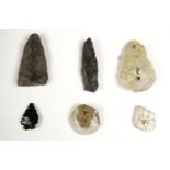 A small collection of pre-historic flint implements including arrow heads, some bearing old find /