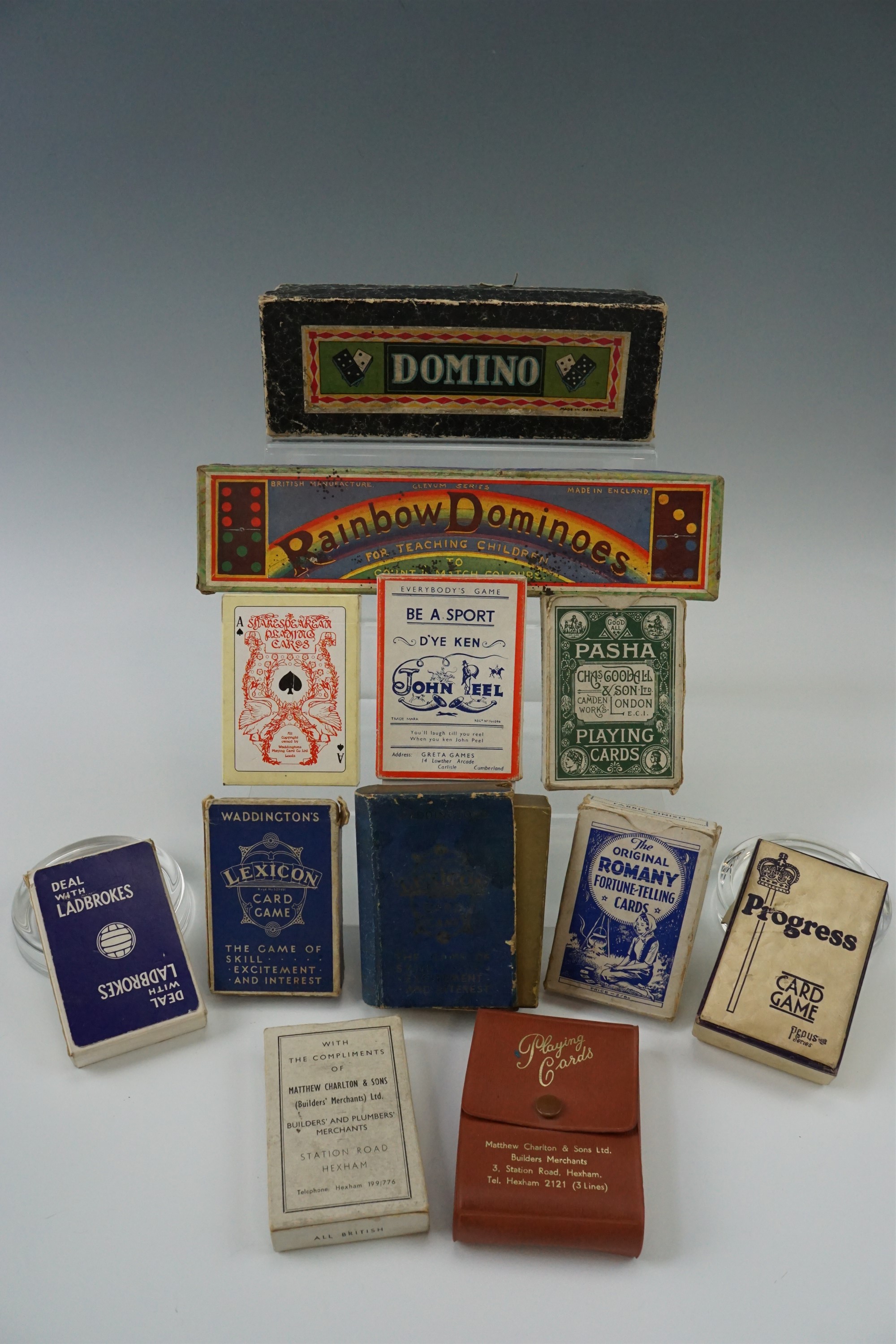A quantity of playing cards and dominoes