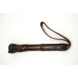 A late 19th Century blackjack or cosh, comprising a short turned hardwood shaft with loaded,