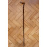 A folk art duck's head walking stick, formed from blackthorn with the pommel carved and painted as a