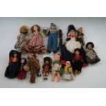 A quantity of early 20th Century and later national dress dolls, tallest 40 cm