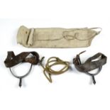 An army "housewife" sewing kit together with a lanyard and a pair of spurs