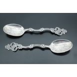 A pair of antique Norwegian white metal rococo influenced teaspoons