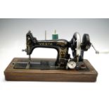 A Vesta hand sewing machine