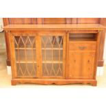 A contemporary Georgian influenced yew wood credenza having astral glazed doors, 148 x 36 x 98 cm