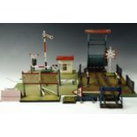 A Marklin 2230 O gauge tinplate level crossing, with picket fences, printed mark to base, 26.5 cm