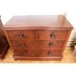 A Victorian mahogany flame figured chest of two short over three long draws each having turned
