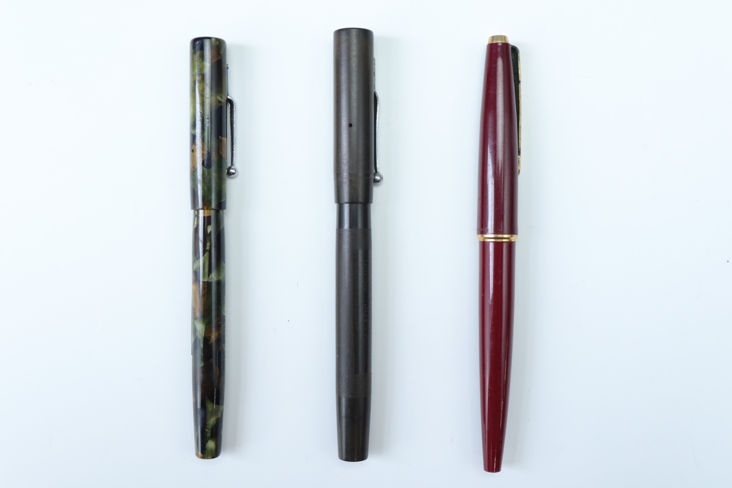 A 1960s Parker 45 refillable fountain pen, with red body, a Swan Minor fountain pen, with a 14 ct