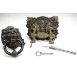 Sundry collectors items including a cast iron lion's mask door knocker, coffin furniture, a