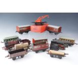 A Hornby OO gauge clockwork locomotive and tender together with various rolling stock including a