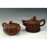 Two Yixing Chinese red stoneware tea pots, tallest 11 cm