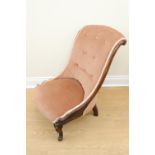 A Victorian walnut nursing chair with button back upholstery