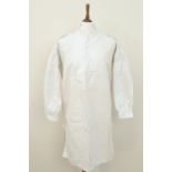 A 19th Century gentleman's shirt, being of linen with a pleated cotton front panel with buttons