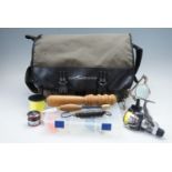 A Daiwa "Wilderness" fishing bag together with a fly tying vice and magnifier, Daiwa "Megaforce