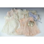 A quantity of vintage infants' clothes etc, together with a pair of Baby Deer infant's shoes