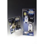 A Star Wars Episode I R2-D2 flying model rocket kit together with a Trade Federation action model
