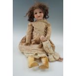 A late 19th / early 20th Century bisque head doll by Armand Marseille, impressed "390", having