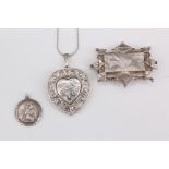 A selection of silver jewellery comprising an Aesthetic brooch, formed as an oblong panel bright cut
