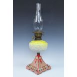 A Victorian cast and glass oil lamp, 60 cm