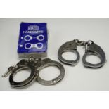 Two sets of Hiatt's handcuffs