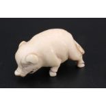 A Japanese ivory netsuke of a pig, 3.5 cm