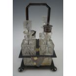 A late 19th / early 20th Century electroplate and glass cruet set, 24 cm