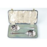 A cased pair of Art Deco influenced Walker & Hall electroplate serving spoons