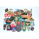 A large quantity of world military cloth insignia
