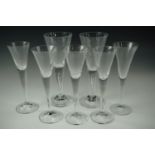 Five 20th Century trumpet wine / liqueur glasses together with two others having teared stems,