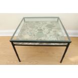 A late 20th Century glass topped coffee table incorporating a shelf set with shards of Chinese