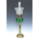 A Victorian brass columnar oil lamp with green glass reservoir, 74 cm