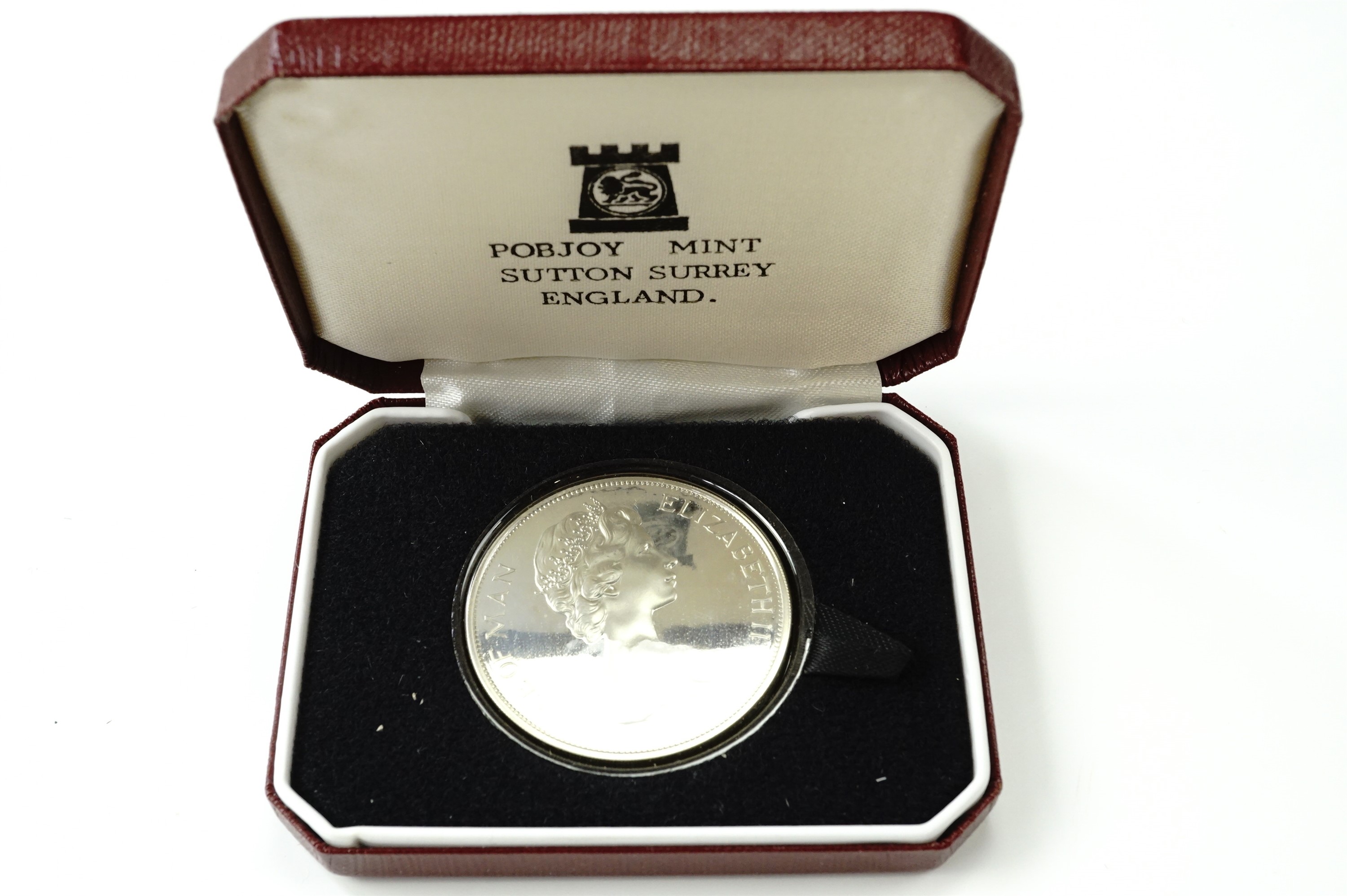 A cased 1976 silver Washington crown coin