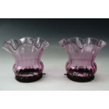 A pair of achromatising pink glass gas lamp shades, 15 cm