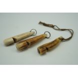 Three dog whistles, formed from carved antler