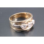 A three-stone garner and nine carat gold ring, having three round brilliant cut white garnets (